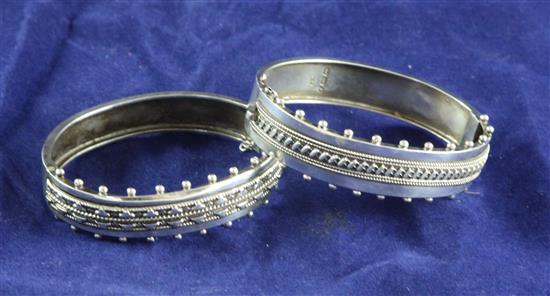 Two similar late Victorian silver hinged bracelets,